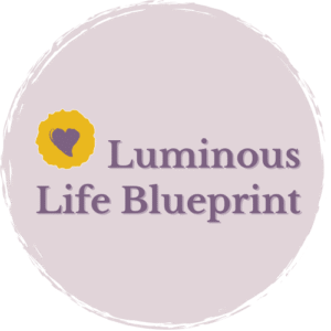 Luminous Life Blueprint logo with purple text and a yellow circle containing a purple heart, set on a light lavender circular background.
